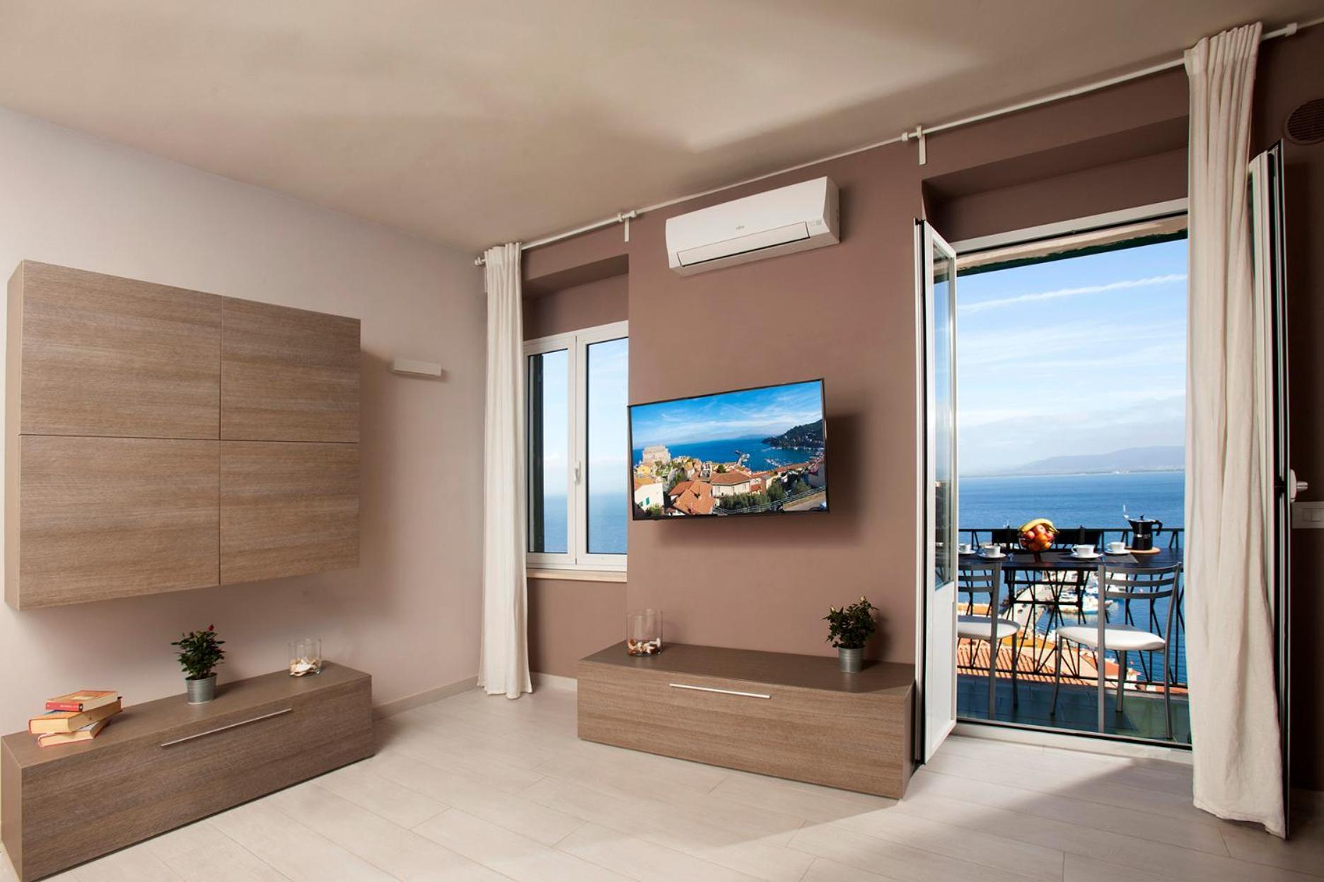 Апартаменты La Casa Al Mare Порто Санто Стефано Экстерьер фото