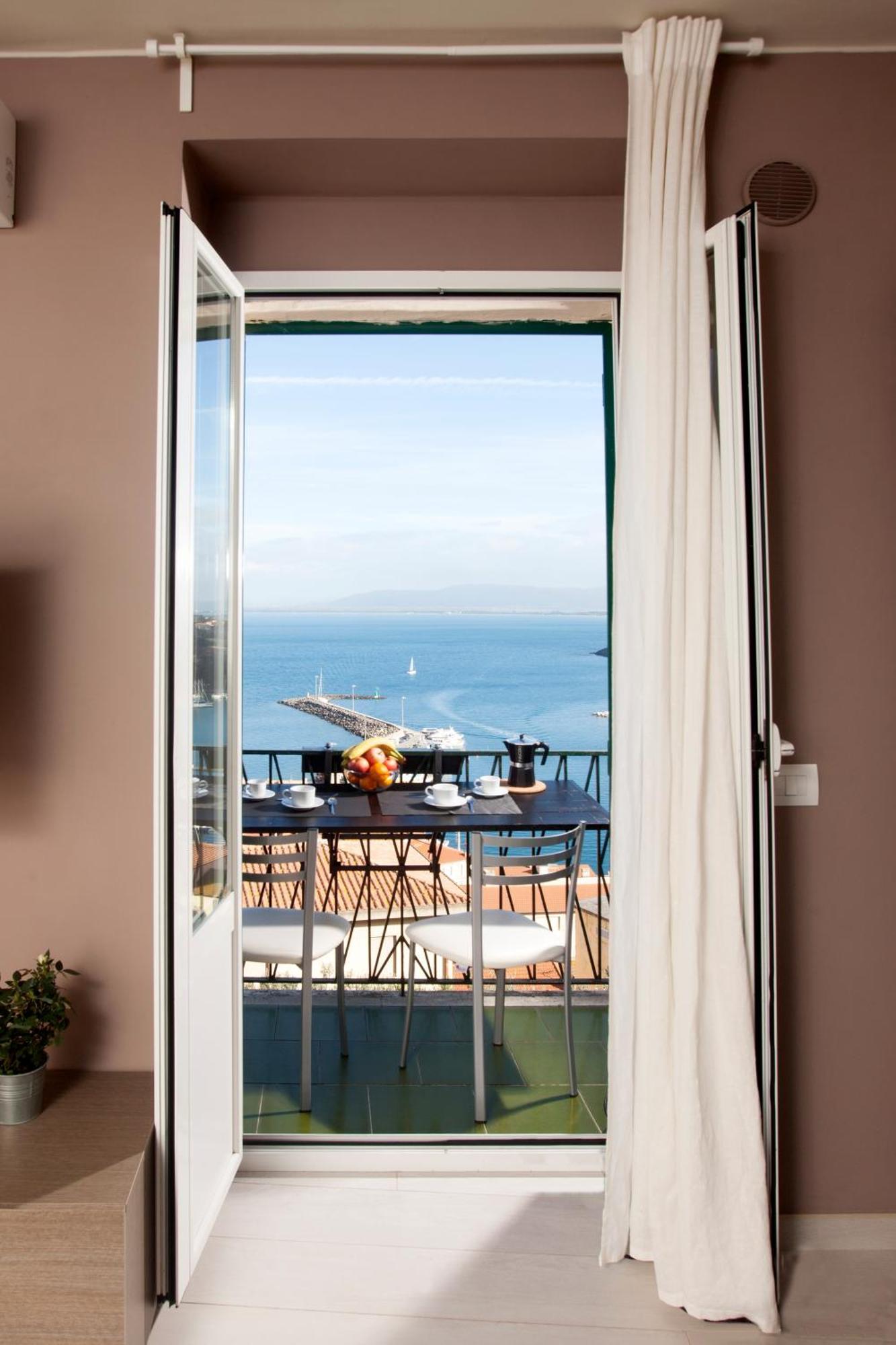 Апартаменты La Casa Al Mare Порто Санто Стефано Экстерьер фото